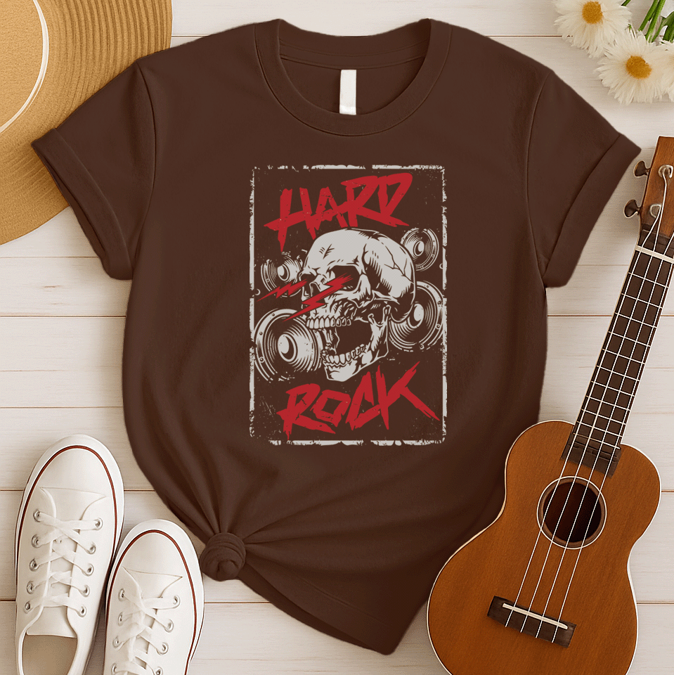 A light grey background features a prominent, light grey, translucent human skull centered. In front of the skull, three distressed red jagged lightning bolts or sound waves are displayed. Distressed red text at the top reads "HARD" and at the bottom, "ROCK". Faint outlines of speakers or audio equipment are visible in the background. The design embodies a powerful hard rock music theme.