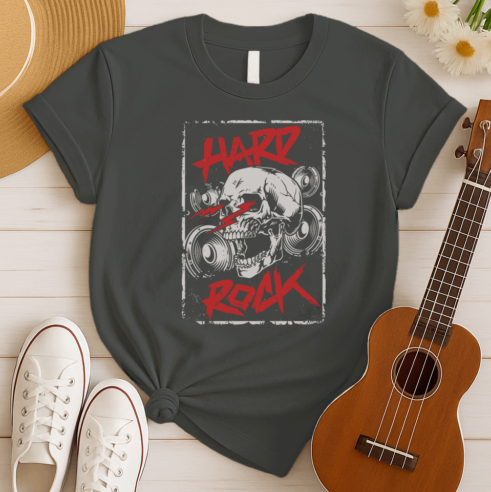 A light grey background features a prominent, light grey, translucent human skull centered. In front of the skull, three distressed red jagged lightning bolts or sound waves are displayed. Distressed red text at the top reads "HARD" and at the bottom, "ROCK". Faint outlines of speakers or audio equipment are visible in the background. The design embodies a powerful hard rock music theme.