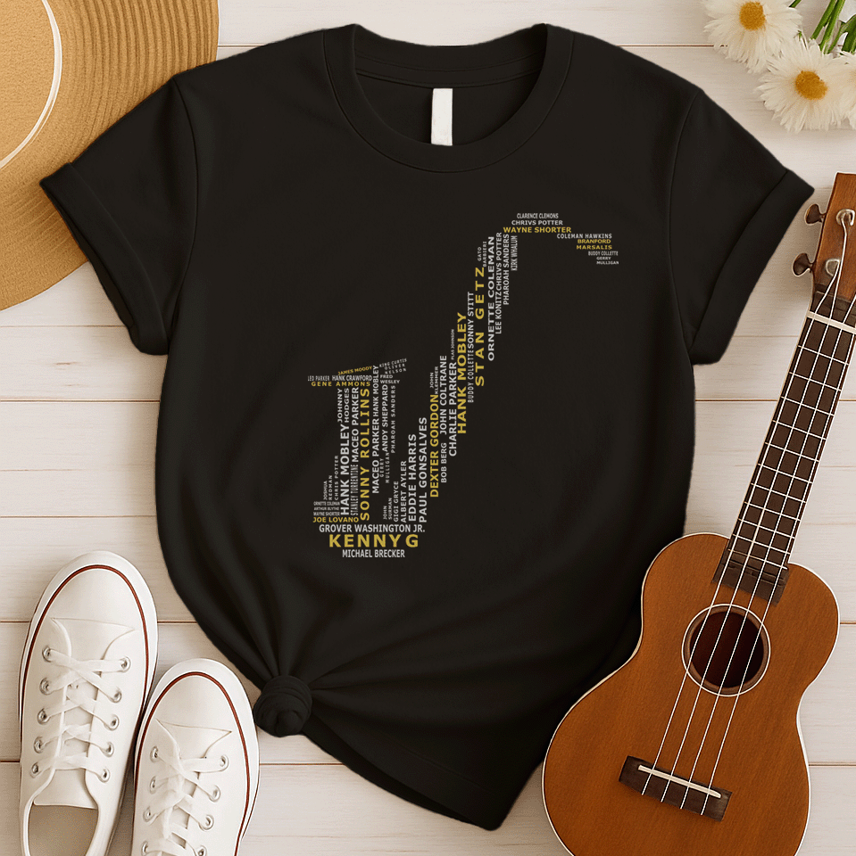 A creative typographic design forms the silhouette of a saxophone using the names of various famous jazz musicians and saxophonists. The names, in white text of varying sizes and fonts, fill the entire shape of the instrument. Prominently featured in larger, bold yellow text at the bottom is "KENNY G", with "MICHAEL BRECKER" directly below it in white, creating a visual tribute to jazz legends.