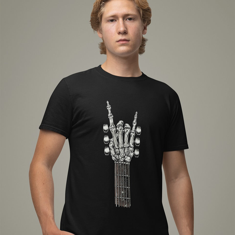 A bold graphic design depicts a skeletal hand forming the classic "rock and roll" sign, with the index and pinky fingers extended upwards, and the thumb holding down the middle two fingers. The hand, rendered in a detailed bone-like texture with shades of white and gray, is positioned at the top of a guitar fretboard, which features brown and white frets and tuning pegs on either side. This powerful image symbolizes the enduring spirit of rock music and its connection to the eternal nature of this genre.