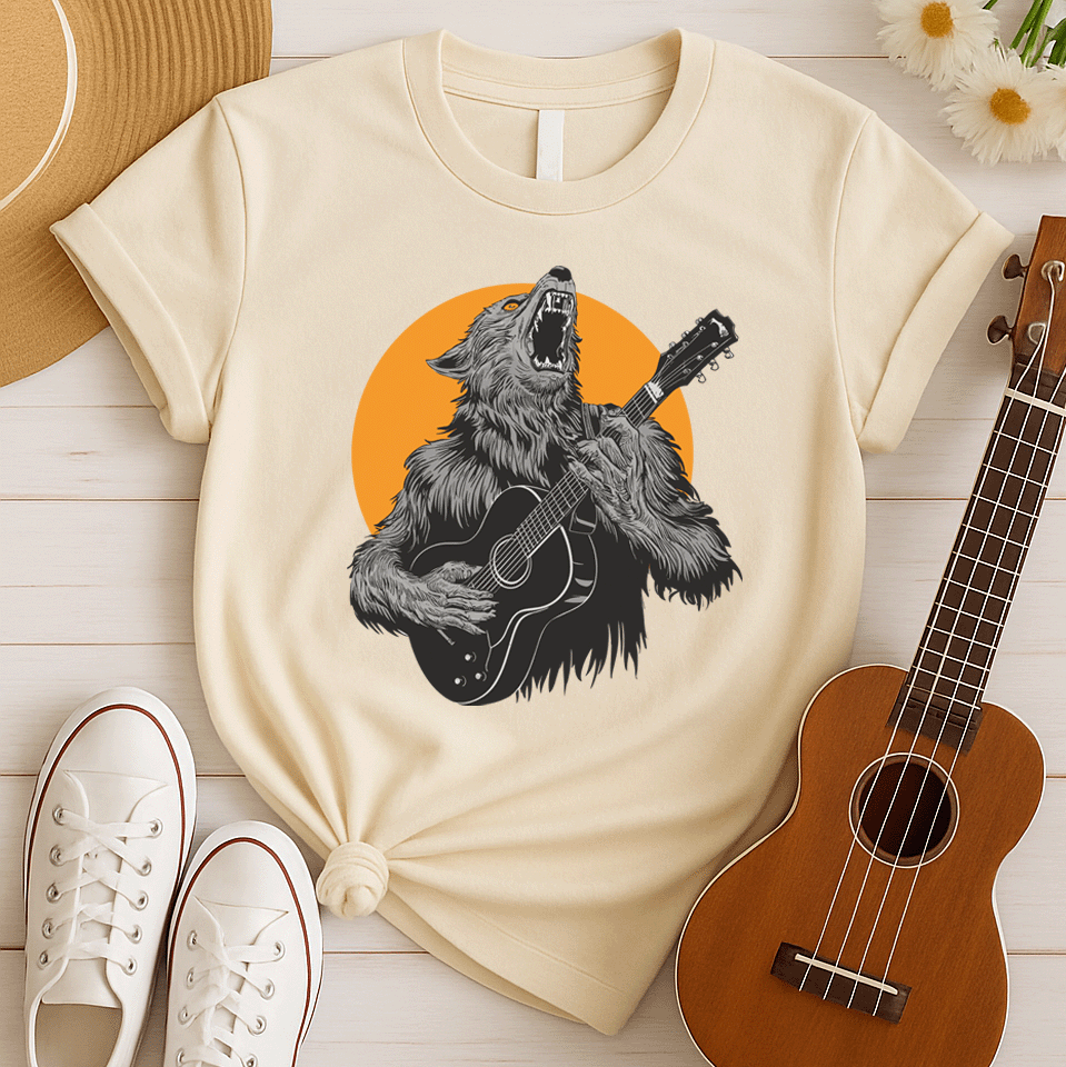A fierce graphic design showcases a roaring werewolf, rendered in shades of grey and black with piercing orange eyes, powerfully playing an acoustic guitar. The werewolf's head is tilted back, howling, and its sharp teeth and tongue are visible. Behind the creature, a large, vibrant orange circle creates a dramatic backdrop, reminiscent of a full moon or fiery sun. The entire composition conveys a raw, untamed passion for music and a connection to supernatural energy