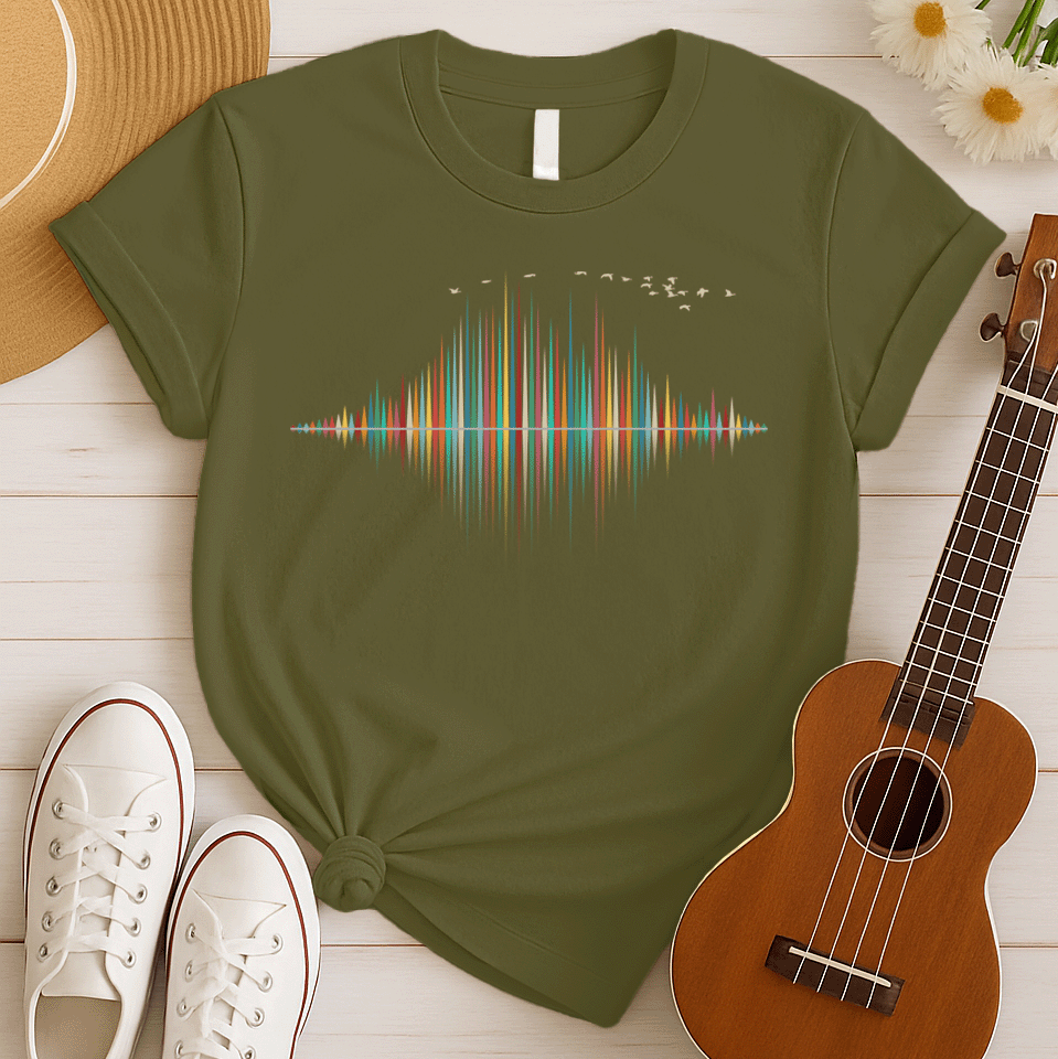 A dynamic graphic design showcases a colorful sound equalizer or sound wave, with vertical bars of varying heights in shades of red, orange, green, blue, and yellow. The bars appear to rise from and reflect into a central horizontal axis, creating a symmetrical visual representation of sound. A flock of small, light-colored birds flies in an arc across the top right of the design, adding a sense of movement. The entire vibrant composition symbolizes music, audio, or a vibrant auditory experience.