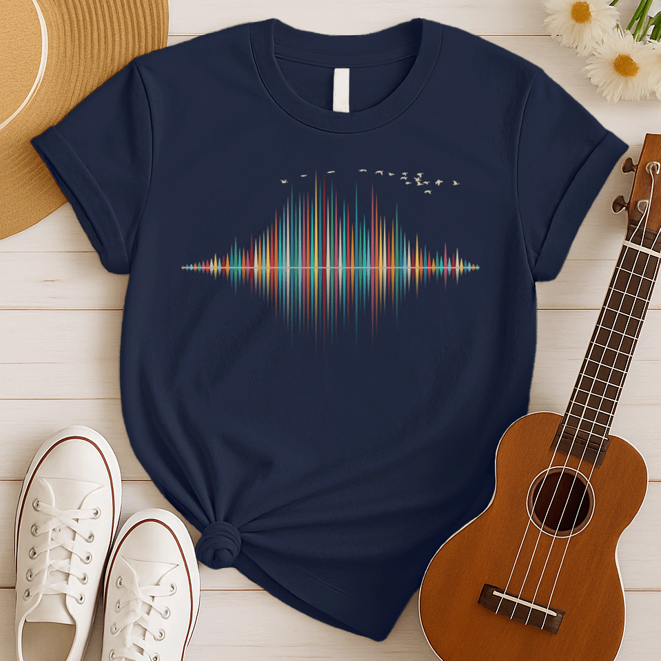 A dynamic graphic design showcases a colorful sound equalizer or sound wave, with vertical bars of varying heights in shades of red, orange, green, blue, and yellow. The bars appear to rise from and reflect into a central horizontal axis, creating a symmetrical visual representation of sound. A flock of small, light-colored birds flies in an arc across the top right of the design, adding a sense of movement. The entire vibrant composition symbolizes music, audio, or a vibrant auditory experience.