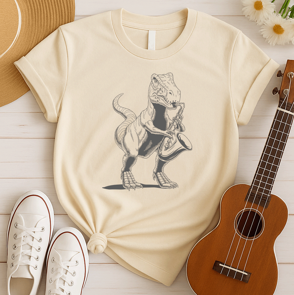 A powerful graphic design depicts a dark grey Tyrannosaurus Rex (T-Rex) holding and seemingly playing a saxophone. The T-Rex is detailed with scales and a strong posture, clutching the saxophone in its small but capable forelimbs. The musical instrument is rendered in a slightly lighter shade of grey, showcasing its keys and bell. This unique illustration, humorously blends prehistoric might with the smooth sounds of jazz or blues.
