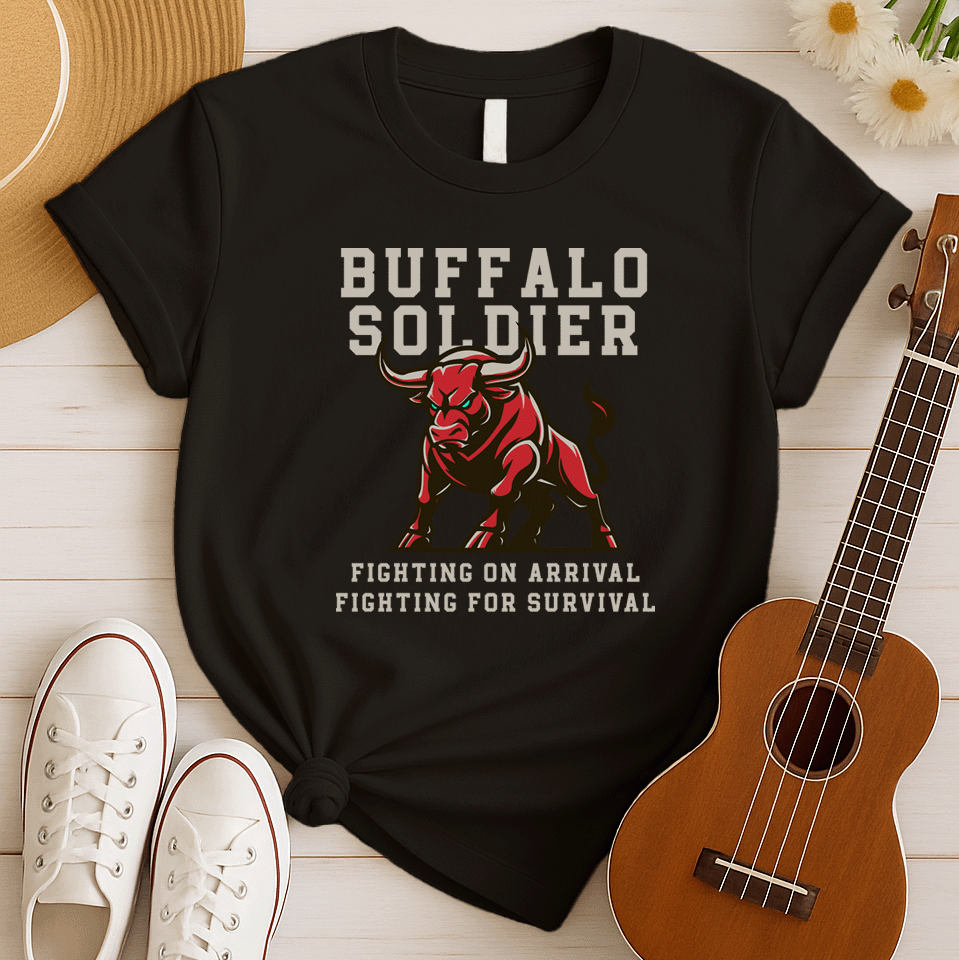 A striking graphic design features a powerfully built red bull with menacing green eyes and prominent horns, depicted in a charging or aggressive stance. The bull's body is outlined in a lighter shade of red, giving it depth. Above the bull, the words "BUFFALO SOLDIER" are written in bold, athletic-style block letters, with "BUFFALO" in white and "SOLDIER" in light grey. Below the bull, two lines of text read "FIGHTING ON ARRIVAL" and "FIGHTING FOR SURVIVAL," both in white, bold, block letters.