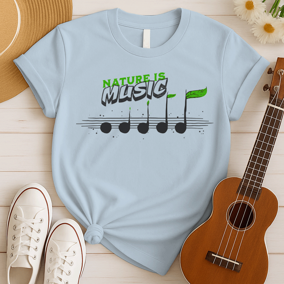 A black background features the text "NATURE IS" in a distressed green font at the top. Below it, the word "MUSIC" is prominently displayed in a larger, distressed dark grey font with a subtle 3D effect. Below the text, a horizontal musical staff is shown with five round, dark grey quarter notes. Each note has a small green leaf growing from its stem, with the last note having a larger, more prominent green leaf. The design symbolizes the connection between nature and music, perfect for environmentalists an