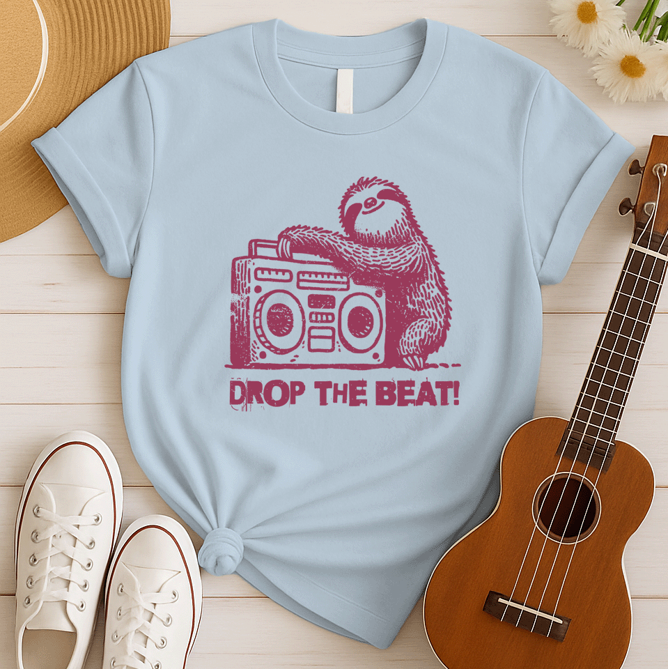 A light grey background features a distressed, red-brown illustration of a fluffy sloth. The sloth is leaning on a large, matching red-brown boombox, which has prominent speakers and controls. Below the sloth and boombox, the distressed text "DROP THE BEAT!" is written in a blocky, red-brown font with a slight splattered effect. The design portrays a relaxed animal enjoying loud music from a retro radio.