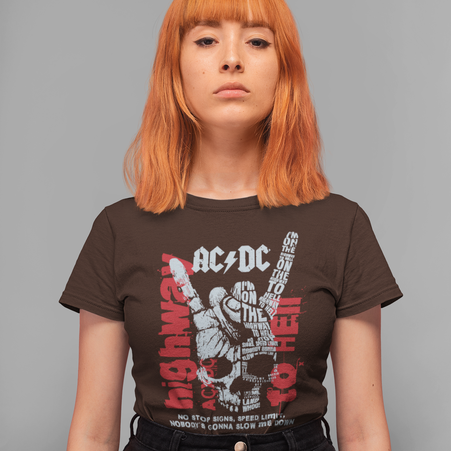 A dark green background with distressed red splatters features a large, faded grey/white illustration of a hand making the "rock on" (devil horns) gesture. The stylized AC/DC logo is at the top. Within and around the hand, various distressed red and grey texts display lyrics from "Highway to Hell," including the repeated phrase "I'M ON THE HIGHWAY TO HELL" and "NO STOP SIGNS, SPEED LIMIT, NOBODY'S GONNA SLOW ME DOWN". The design is a powerful tribute to AC/DC, rock music, and a rebellious attitude.