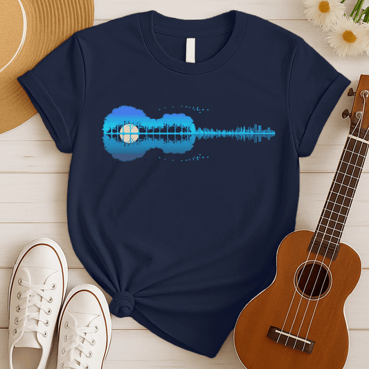 A horizontal silhouette of an acoustic guitar, its body formed by lush, dense trees in shades of blue and purple, with a large, pale yellow moon or sun visible through a clearing in the trees, forming the soundhole. The neck of the guitar transitions into a vibrant blue sound wave or equalizer graphic, which then evolves into a cityscape of buildings. A flock of small, dark birds flies in an arc above the trees, with a smaller flock near the bottom, creating a serene yet dynamic musical landscape.