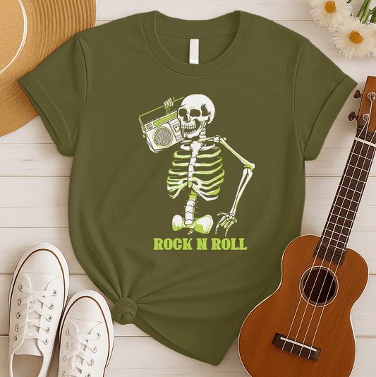 A striking graphic design features a full skeleton, rendered in white with a vibrant lime green glow on its bones, posed in a dynamic, walking stance. The skeleton holds a detailed, white outline of a retro boombox over its right shoulder. Below the skeleton, the bold, lime green text "ROCK N ROLL" is prominently displayed, creating a cool, energetic, and slightly spooky tribute to classic music.