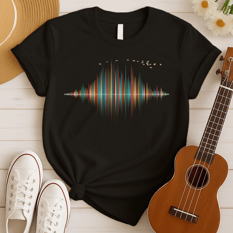 A dynamic graphic design showcases a colorful sound equalizer or sound wave, with vertical bars of varying heights in shades of red, orange, green, blue, and yellow. The bars appear to rise from and reflect into a central horizontal axis, creating a symmetrical visual representation of sound. A flock of small, light-colored birds flies in an arc across the top right of the design, adding a sense of movement. The entire vibrant composition symbolizes music, audio, or a vibrant auditory experience.