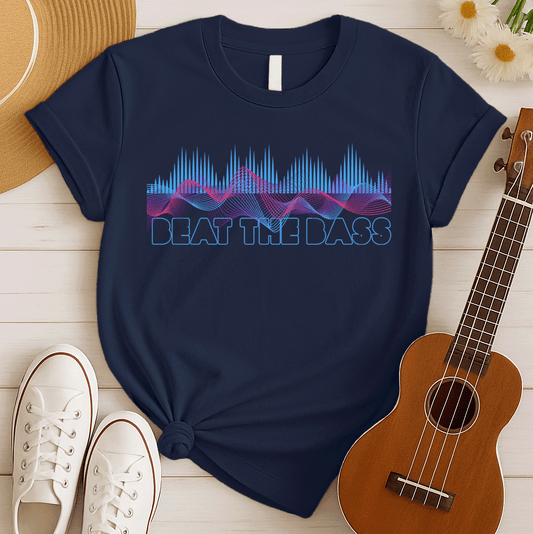 A vibrant graphic design features dynamic pink and blue sound waves undulating across a black background, interspersed with vertical blue equalizer bars that rise and fall. Below these auditory visuals, the phrase "BEAT THE BASS" is rendered in bold, outlined blue text. This energetic composition visually represents powerful bass music and electronic sound.