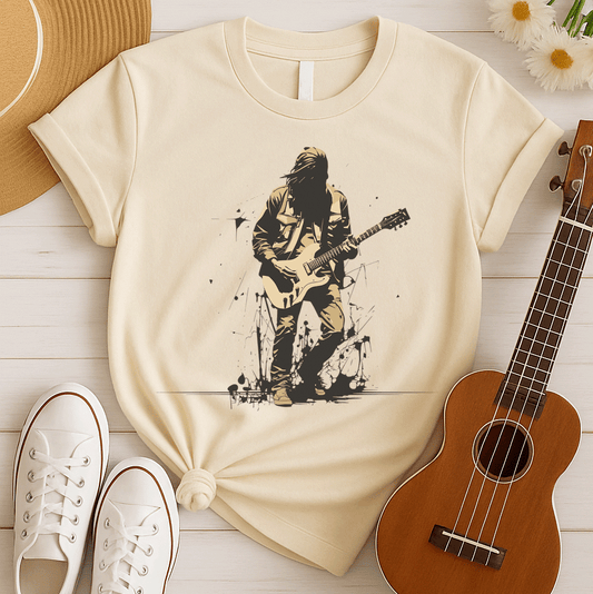 A striking graphic design depicts a silhouetted rock musician, with dark, flowing hair and a black outline, intensely playing a light beige electric guitar. The musician wears a detailed beige jacket and pants, with their form subtly highlighted against the darker background. Splatters of black paint or ink are visible around the musician's feet, adding a raw, energetic, and slightly rebellious aesthetic to the overall composition.