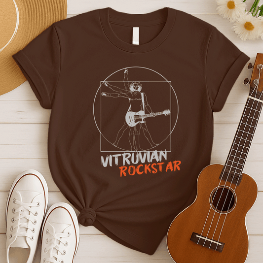 A stylized graphic design, reminiscent of Leonardo da Vinci's Vitruvian Man, depicts a shirtless figure with long hair and multiple arms and legs in various poses within a white circle and square. Instead of open palms, the figure holds an electric guitar across its body, suggesting a musical twist. Below the illustration, the words "VITRUVIAN" in distressed white text and "ROCKSTAR" in distressed orange text are prominently displayed, all set against a solid black background. The design blends classical ar