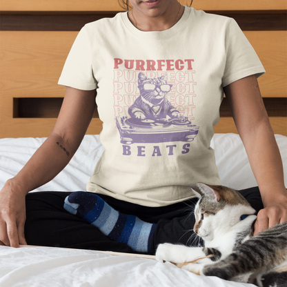 Stylized graphic of a cool purple cat wearing sunglasses and a suit jacket, confidently scratching on a large DJ turntable. Red text repeats "PURRFECT" in the background, and large purple text below reads "BEATS". The design embodies DJ culture, electronic music, and a humorous feline twist, ideal for DJs, cat lovers, and music enthusiasts.