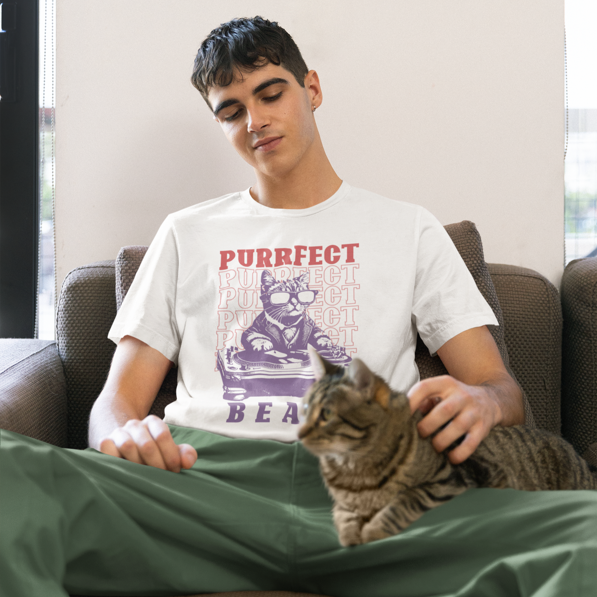 Stylized graphic of a cool purple cat wearing sunglasses and a suit jacket, confidently scratching on a large DJ turntable. Red text repeats "PURRFECT" in the background, and large purple text below reads "BEATS". The design embodies DJ culture, electronic music, and a humorous feline twist, ideal for DJs, cat lovers, and music enthusiasts.