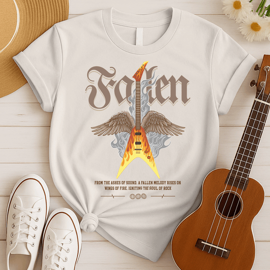 Dramatic graphic featuring a vibrant yellow and orange electric guitar engulfed in flames with large brown feathered wings, rising from grey smoke. The design powerfully symbolizes the resurrection and enduring spirit of rock and metal music, driven by a fiery guitar, ideal for guitar lovers and hard rock fans.