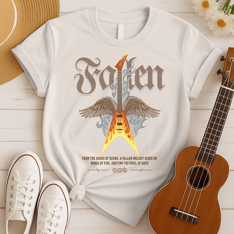 Dramatic graphic featuring a vibrant yellow and orange electric guitar engulfed in flames with large brown feathered wings, rising from grey smoke. The design powerfully symbolizes the resurrection and enduring spirit of rock and metal music, driven by a fiery guitar, ideal for guitar lovers and hard rock fans.