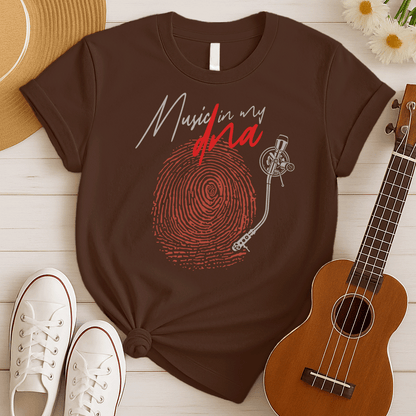 Stylized graphic of a large red fingerprint that is designed like the grooves of a vinyl record, with a white turntable tonearm and needle positioned on it. Above, white handwritten text says "Music in my" and red stylized text says "dna". The design perfectly symbolizes an inherent passion for music, vinyl records, and unique identity, ideal for music lovers and DJs.