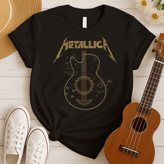 Distressed gold Metallica band logo with lightning bolts above a detailed black and gold outline of an acoustic guitar featuring intricate scrollwork around the soundhole, a perfect rock music design.