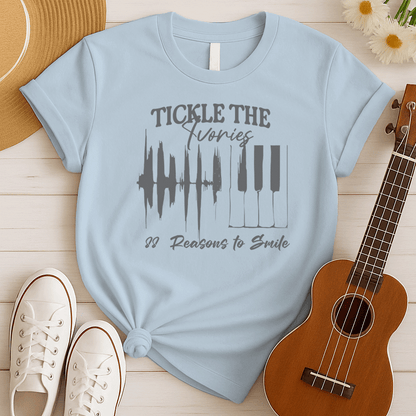 A light background features a graphic with a jagged sound wave transitioning into a set of classic piano keys in dark grey. Below the graphic, dark grey text reads "88 Reasons to Smile". The design prominently features text at the top, "TICKLE THE Ivories". This image symbolizes the joy of music, piano playing, and musical happiness, ideal for pianists and music enthusiasts.